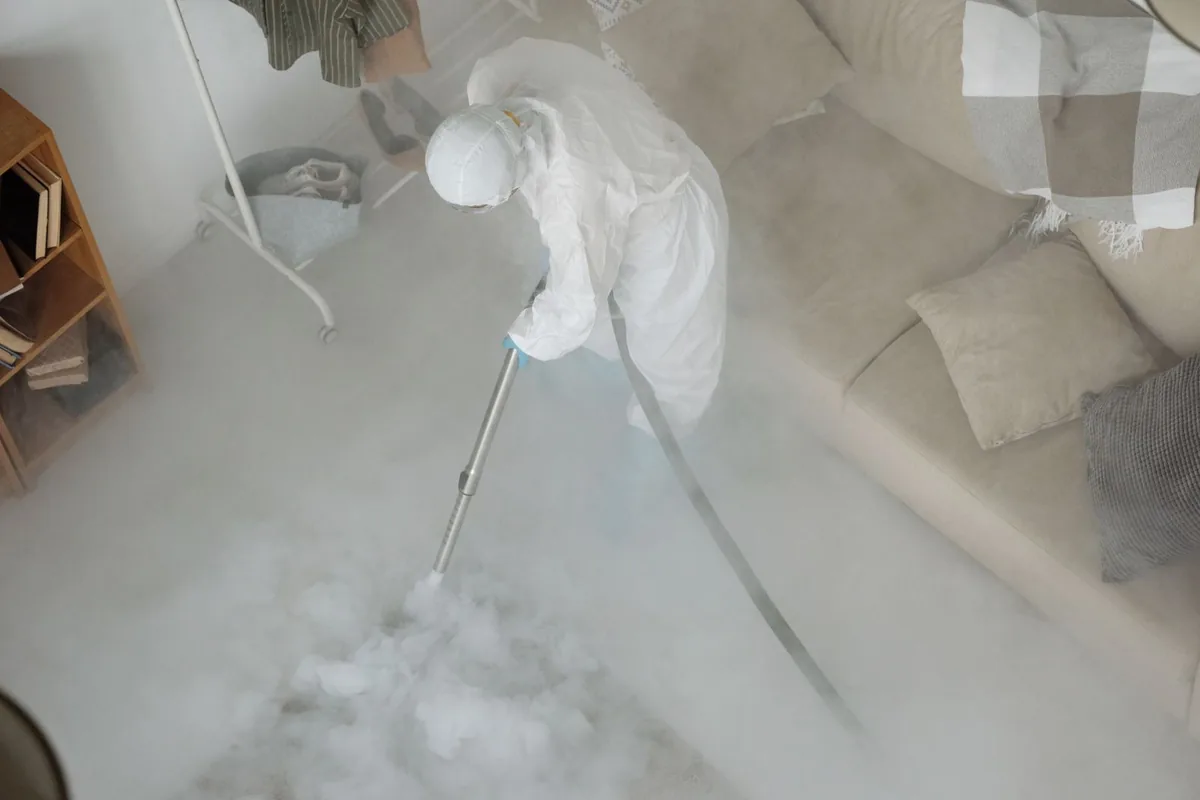 Biohazard cleanup technician in protective equipment, Bozeman, MT
